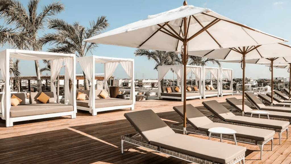 Rooftop terrace with shaded cabanas and lounge chairs